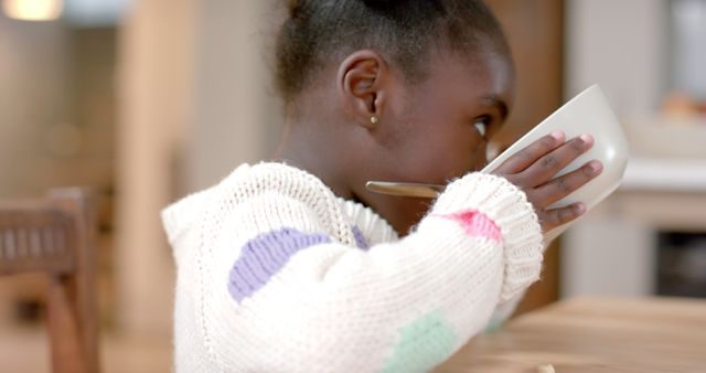 Child Drinking from Bowl in Cozy Indoor Environment - Download Free Stock Images Pikwizard.com