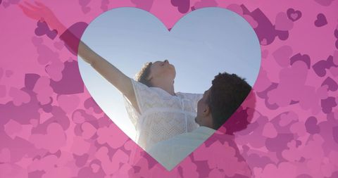 Romantic Beach Scene with Joyful Couple Surrounded by Hearts