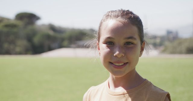 Smiling Schoolgirl Outdoors with Blurred Background - Download Free Stock Images Pikwizard.com