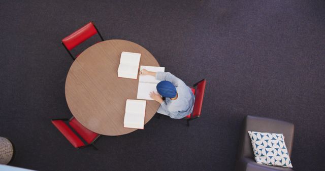 Student with Headscarf Studying at Round Table from Above - Download Free Stock Images Pikwizard.com