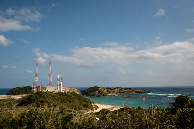 Japanese H-IIA rocket seen rolling out to launch pad 1 at the Tanegashima Space Center in Japan. The rocket will carry the NASA-JAXA Global Precipitation Measurement Core Observatory, aiming to unify global rainfall and snowfall data. Useful for content related to space exploration, Japanese aerospace achievements, and NASA-JAXA collaborations.