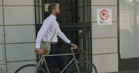 Businessman Commuting with Bicycle in Urban Setting - Download Free Stock Images Pikwizard.com