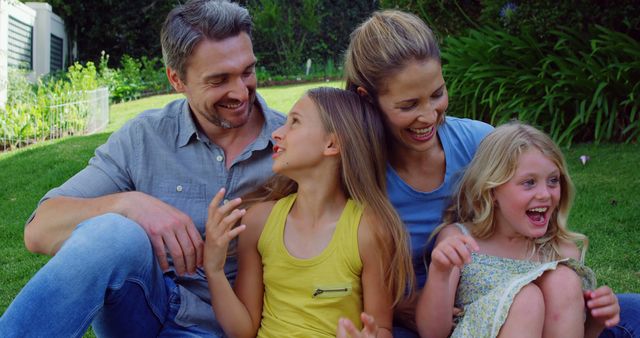 Happy Family Enjoying Quality Time Outdoors on Lawn - Download Free Stock Images Pikwizard.com