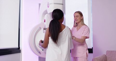 Mammogram Technologist Guiding Patient Through Mammography Positioning With Gentle Care