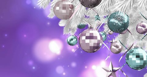 Festive Christmas Ornaments on Tree with Purple Light Background