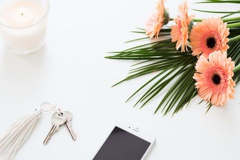 Modern workspace with floral decor and technology smartphone