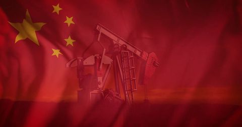 Chinese Flag Blending into Oil Pump Jack in Silhouette