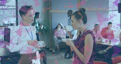 Professional Women Networking Over Coffee in Modern Business Lounge