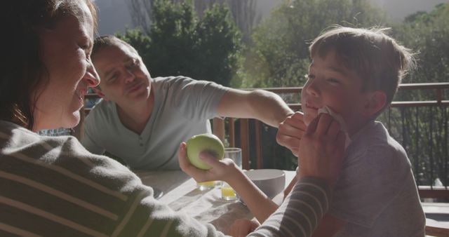 Happy Family Enjoying Breakfast Outdoors on Sunny Morning - Download Free Stock Images Pikwizard.com