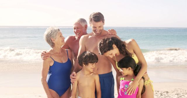 Smiling multigenerational family spending quality time together at a beach on a sunny day. Ideal for promoting family vacations, travel destinations, advertisements for travel agencies, and family-focused products. Can also illustrate family bonding, happy memories, and outdoor lifestyle.