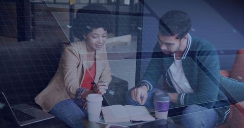 Diverse Colleagues Collaborating Over Coffee in Coworking Space