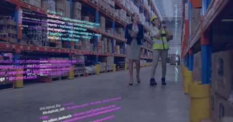 Manager inspecting inventory while worker scanning shelves in smart warehouse with code overlay