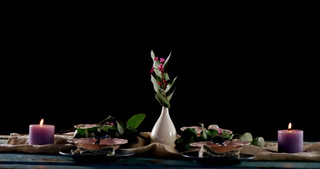 Elegant Table Setting with Candles, Leaves, and Flowers Against Black Background - Download Free Stock Images Pikwizard.com