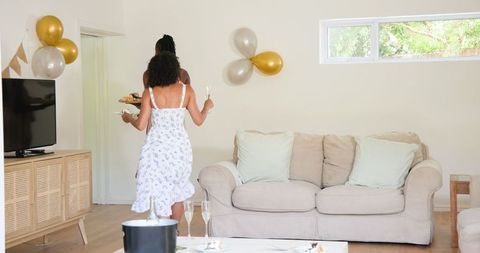 Friends Tidying Up After Lively Celebration, Enhancing Collaboration