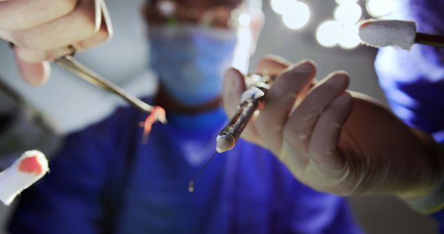 Surgeons performing medical procedure in bright operating room - Download Free Stock Images Pikwizard.com