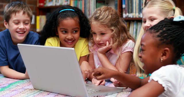 Curious Children Learning Together on Laptop in Library - Download Free Stock Images Pikwizard.com