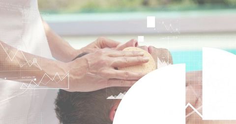 Man receiving facial treatment at poolside spa with caregiver holding loofah and towel