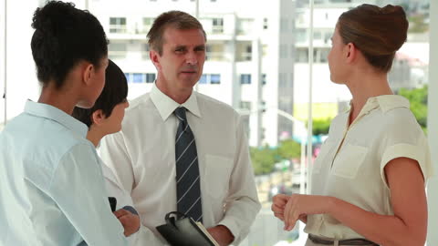 Professional Team Engaged in Office Discussion