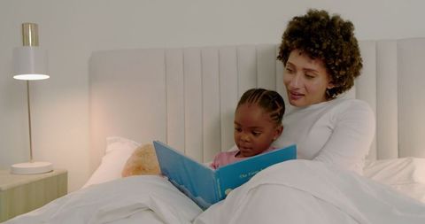 Mother and Daughter Bonding Over Bedtime Story
