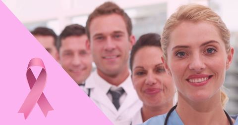 Smiling Medical Team with Breast Cancer Awareness Ribbon