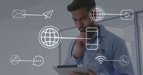 Doctor Using Tablet with Digital Interface Technology Icons in Modern Office