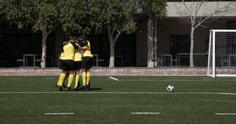 Soccer Team Huddle Before Match Outdoors