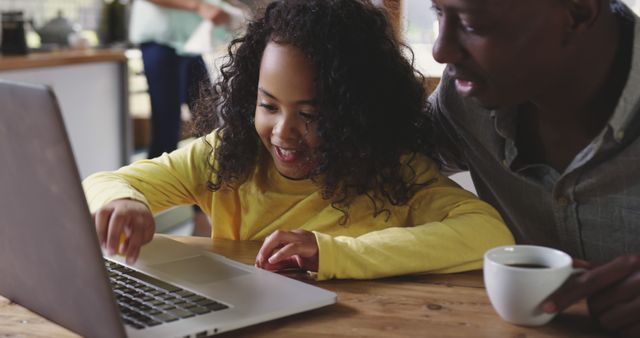 Father and daughter bonding over computer at home - Download Free Stock Images Pikwizard.com