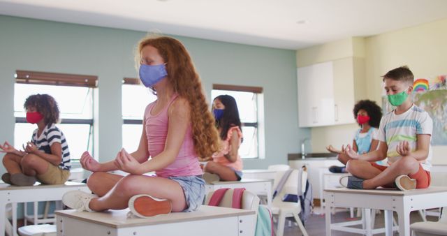 Group of Children Practicing Yoga in Classroom While Wearing Masks - Download Free Stock Images Pikwizard.com