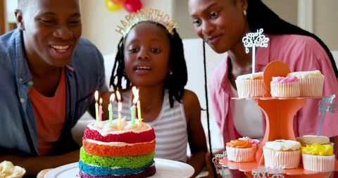 Family Birthday Celebration with Rainbow Cake and Cupcakes