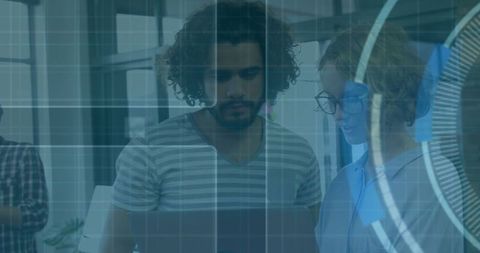 Collaborative Team Analyzing Digital Data Overlay in Modern Office