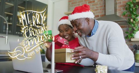 Couple joyfully video calling loved ones on laptop with Christmas hats and wrapped gifts. Perfect for holiday communications, family and gifting promotions, and festive greeting design concepts.