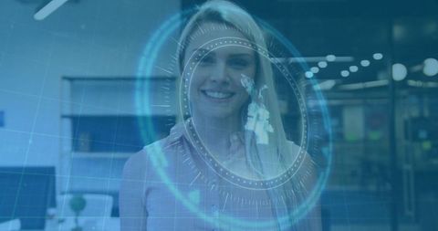 Businesswoman Engaging with Futuristic Holographic Display in Office