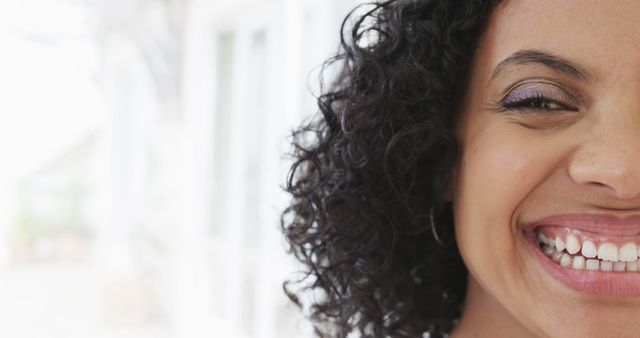 Young Woman Smiling with Curly Hair and Bright Eyes - Download Free Stock Images Pikwizard.com