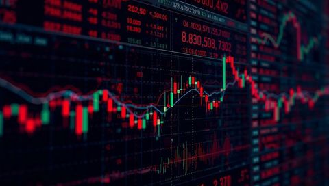 Displaying candlestick chart with moving averages showing market volatility and volume