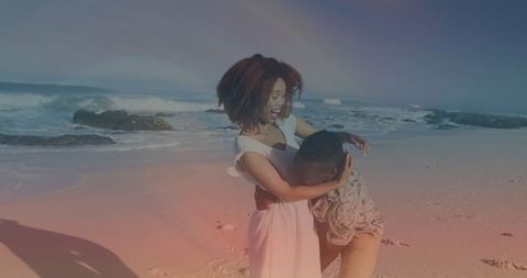 Happy Couple Embracing on Sunny Scenic Beach Shoreline