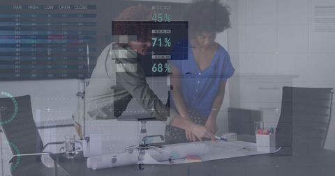 Diverse Business People Analyzing Financial Data in Modern Office Environment