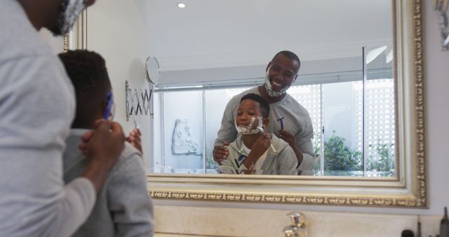 Father and Son Bonding Through Shaving Activity in Bathroom - Download Free Stock Images Pikwizard.com