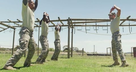 Diverse Soldiers Engaging in Outdoor Workout on Military Course
