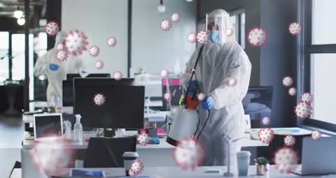 Professional Disinfection Team Sanitizing Office Workspace