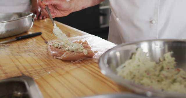 Chef Preparing Stuffed Chicken Fillet with Herb Mixture in Professional Kitchen - Download Free Stock Images Pikwizard.com