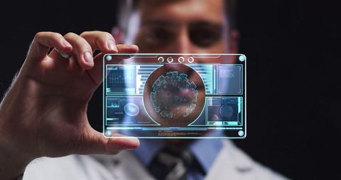 Scientist Holding Futuristic Digital COVID-19 Analysis Screen - Download Free Stock Images Pikwizard.com