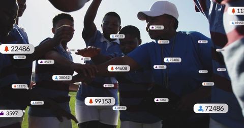 Youth rugby team huddling with social media engagement badges, backlit team unity
