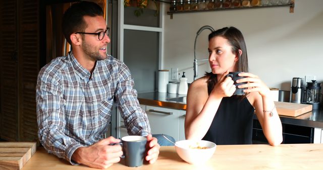 Casual Breakfast Conversation Between Man and Woman in Modern Kitchen - Download Free Stock Images Pikwizard.com