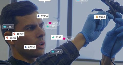 Engineer testing device with social engagement icons in modern office