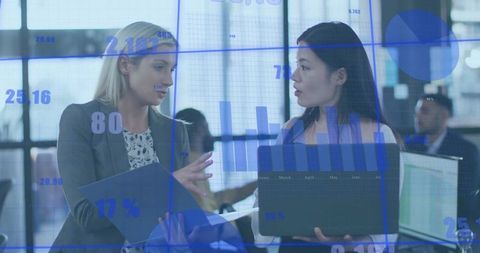 Business Professionals Collaborating Over Data Analysis in Modern Office