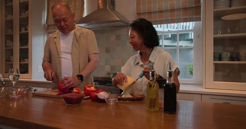 Senior Couple Cooking Together in Cozy Home Kitchen Setting