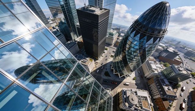 Aerial view gherkin building reflecting sunlight over city of london skyline