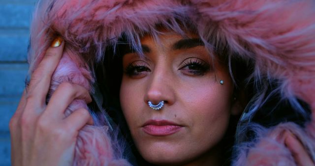 Confident Woman in Pink Fur Hood with Piercings - Download Free Stock Images Pikwizard.com