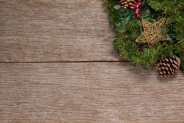 Wreath with christmas decoration on a plank
