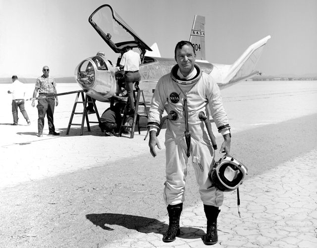 Perfect for illustrating the history of aerospace research and NASA's testing programs, this vintage 1969 photo captures NASA research pilot Bill Dana standing proudly in front of the HL-10 Lifting Body Glider at NASA's Dryden Flight Research Center. Can be used in articles, historical exhibits, educational materials, and documentaries focused on space exploration, research pilots, or 20th-century aviation achievements.